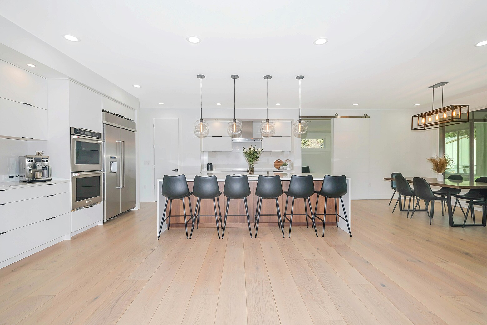 A modern looking kitchen with stainless steel appliances.